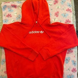 This is an XS red adidas hoodie.